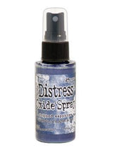 Load image into Gallery viewer, Tim Holtz - Distress Oxide Spray. Creates oxidized effects when sprayed with water. Use for quick and easy ink coverage on porous surfaces. Spray through stencils, layer colors, spritz with water and watch the color mix and blend. Available at Embellish Away located in Bowmanville Ontario Canada. Chipped Sapphire