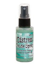 Load image into Gallery viewer, Tim Holtz - Distress Oxide Spray. Creates oxidized effects when sprayed with water. Use for quick and easy ink coverage on porous surfaces. Spray through stencils, layer colors, spritz with water and watch the color mix and blend. Available at Embellish Away located in Bowmanville Ontario Canada. Evergreen Bough