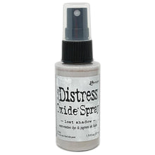 Load image into Gallery viewer, Tim Holtz - Distress Oxide Spray. Creates oxidized effects when sprayed with water. Use for quick and easy ink coverage on porous surfaces. Spray through stencils, layer colors, spritz with water and watch the color mix and blend. Available at Embellish Away located in Bowmanville Ontario Canada. Lost Shadow