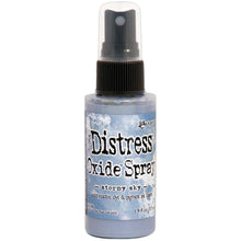Load image into Gallery viewer, Tim Holtz - Distress Oxide Spray. Creates oxidized effects when sprayed with water. Use for quick and easy ink coverage on porous surfaces. Spray through stencils, layer colors, spritz with water and watch the color mix and blend. Available at Embellish Away located in Bowmanville Ontario Canada. Stormy Sky
