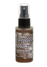 Load image into Gallery viewer, Tim Holtz - Distress Oxide Spray. Creates oxidized effects when sprayed with water. Use for quick and easy ink coverage on porous surfaces. Spray through stencils, layer colors, spritz with water and watch the color mix and blend. Available at Embellish Away located in Bowmanville Ontario Canada. Walnut Stain