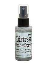 Load image into Gallery viewer, Tim Holtz - Distress Oxide Spray. Creates oxidized effects when sprayed with water. Use for quick and easy ink coverage on porous surfaces. Spray through stencils, layer colors, spritz with water and watch the color mix and blend. Available at Embellish Away located in Bowmanville Ontario Canada. weathered Wood