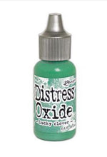 Load image into Gallery viewer, Tim Holtz-Ranger Distress Oxides Reinkers. This water-reactive dye and pigment ink fusion creates an oxidized effect when sprayed with water. Use to re-ink Distress Oxide Ink Pads (sold separately). Available at Embellish Away located in Bowmanville Ontario Canada. Lucky Clover