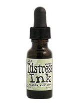 Load image into Gallery viewer, Tim Holtz - Distress Reinker. Create an aged look on papers, fibers, photos and more! This package contains one 0.5oz bottle of distress ink. Acid free. Conforms to ASTM D4236. Comes in a variety of colors. Each sold separately. Available at Embellish Away located in Bowmanville Ontario. Shabby Shutters