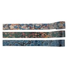 Load image into Gallery viewer, Tim Holtz - Idea-Ology - Design Tape - Marbled. Design Tape Marbled by Tim Holtz is adhesive-backed printed imagery used for a variety of projects. The wide width is ideal for adhering ephemera and other paper elements to junk journals, cards and more. Available at Embellish Away located in Bowmanville Ontario Canada.