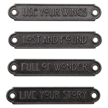 Load image into Gallery viewer, Tim Holtz - Idea-Ology - Metal Word Plaques - 4/Pkg. Tim Holtz Word Plaques are metal labels that feature unique raised words on each. Simply adhere or use Tim Holtz fasteners for an expressive label on your next make. Word Plaques by Tim Holtz are decorative metal labels with raised words. Available at Embellish Away located in Bowmanville Ontario Canada.