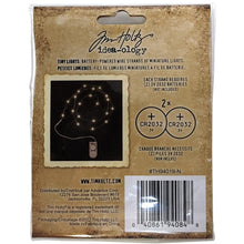 Load image into Gallery viewer, Tim Holtz - Idea-Ology Battery - Operated Wire Light Strands - 2/Pkg - Tiny Lights - Clear (No Batteries). While you need the perfect paper to start your project, you also need the perfect embellishment! Requires two 3V 2032 batteries, not included. Available at Embellish Away located in Bowmanville Ontario Canada.