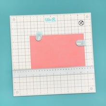 Charger l'image dans la galerie, We R Memory Keepers - All-In-One Magnetic Platform. The All-In-One Magnetic Platform is perfect for stenciling, aligning, embossing, and cutting. One side is an easy-clean work surface. Available at Embellish Away located in Bowmanville Ontario Canada.