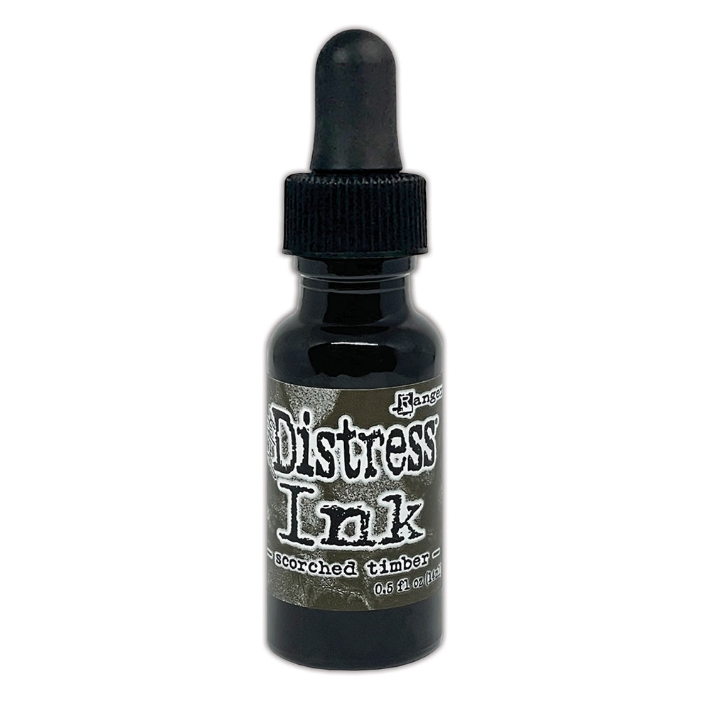 Tim Holtz - Distress  Reinker. Create an aged look on papers, fibers, photos and more! This package contains one 0.5oz bottle of distress ink. Comes in a variety of colors. Scorched Timber. Available at Embellish Away located in Bowmanville Ontario Canada.