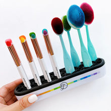Load image into Gallery viewer, Catherine Pooler - Brush-N-Tool Holder. This silicone holder will store your brushes, markers, other tools and even scissors for easy access on your work surface and comes decked out with the beautiful CPD rainbow design. Available at Embellish Away located in Bowmanville Ontario Canada.
