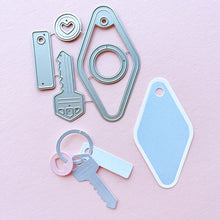 Load image into Gallery viewer, Catherine Pooler - Dies - Suite Motel Key. Create your own Suite Motel Key set with these fun dies. The dies include a key die, tags and &quot;metal&quot; keyring dies for so many fun layering options. Available at Embellish Away located in Bowmanville Ontario Canada.
