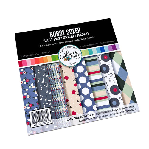 Catherine Pooler - Patterned Paper - Bobby Soxer. The Bobby Soxer Patterned Paper is inspired by life and music of the 1940's. Tweed, tiny flowers and argyle socks- this paper pack has fabric and textile inspired patterns and music inspired prints! Available at Embellish Away located in Bowmanville Ontario Canada.
