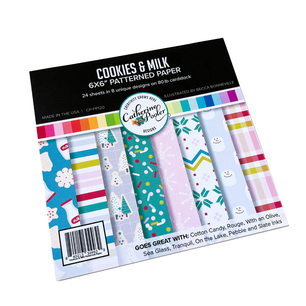 Catherine Pooler - Patterned Paper - Cookies & Milk. Don't forget to leave out the Cookies & Milk for Santa! The Cookies & Milk Patterned Paper pack is a sweet mix of holiday patterns and prints. Available at Embellish Away located in Bowmanville Ontario Canada.