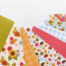 Load image into Gallery viewer, Catherine Pooler - Patterned Paper - Sunflower Fields. Add a pattern or print from Sunflower Fields Forever Patterned Paper to your fall cards and projects. Pretty plaids and sunflower prints are mixed in with fall leaves in this pack. Available at Embellish Away located in Bowmanville Ontario Canada.
