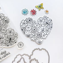 Load image into Gallery viewer, Catherine Pooler - Stamp &amp; Die Set - Hearts Aflutter. Set someone&#39;s heart aflutter with this beautiful stamp set and coordinating dies! The Hearts Aflutter Stamps features a large, line-art heart made of flowers and a butterfly. Available at Embellish Away located in Bowmanville Ontario Canada Example by brand ambassador.
