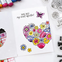 Load image into Gallery viewer, Catherine Pooler - Stamp &amp; Die Set - Hearts Aflutter. Set someone&#39;s heart aflutter with this beautiful stamp set and coordinating dies! The Hearts Aflutter Stamps features a large, line-art heart made of flowers and a butterfly. Available at Embellish Away located in Bowmanville Ontario Canada Example by brand ambassador.
