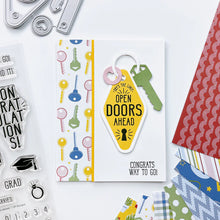 Load image into Gallery viewer, Catherine Pooler - Stamp &amp; Die Set - Open Doors. The 6&quot;x8&quot; Open Doors Stamp Set and coordinating Dies were created with the style of vintage motel keychains. Each illustrated sentiment stamp can be used on it&#39;s own or stamped and die cut on the key fob. Available at Embellish Away located in Bowmanville Ontario Canada. Example by brand ambassador.
