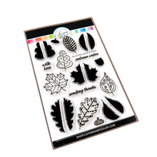 Cargar imagen en el visor de la galería, Catherine Pooler - Stamp &amp; Die Set - Stamp-a-Side Leaves. You will certainly fall for the Stamp-a-Side Leaves Stamp &amp; Die Set. You can stamp the whimsical patterned leaves with multiple ink colors or color the outline image with markers or blender pens. Available at Embellish Away located in Bowmanville Ontario Canada.
