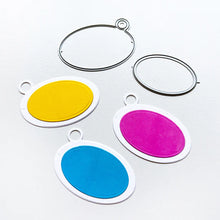 Load image into Gallery viewer, Catherine Pooler - Tag Die - Ink Swatch. Make your own colorful swatch ring. Die cut and direct to paper your center oval. Glue them to the die cut tag bases and tie them together with a piece of twine or us a binder ring for easy access. Available at Embellish Away located in Bowmanville Ontario Canada.
