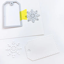 गैलरी व्यूवर में इमेज लोड करें, Catherine Pooler - Tag Die - Snowflake. This gift tag features a dotted edge pattern and additional snowflake die. Cut the snowflake from the tag or cut and paste it on for cards, projects and more! Available at Embellish Away located in Bowmanville Ontario Canada. Example by brand ambassador.
