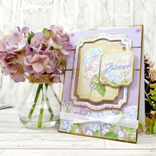 Load image into Gallery viewer, Hunkydory - A4 Deluxe Craft Pads - Forever Florals Hydrangea. Each Pad comes with 4 different topper sets which each include their own foiled and die-cut topper sheet, foiled cardstock, printed cardstock and 2 matching inserts. Available at Embellish Away located in Bowmanville Ontario Canada.
