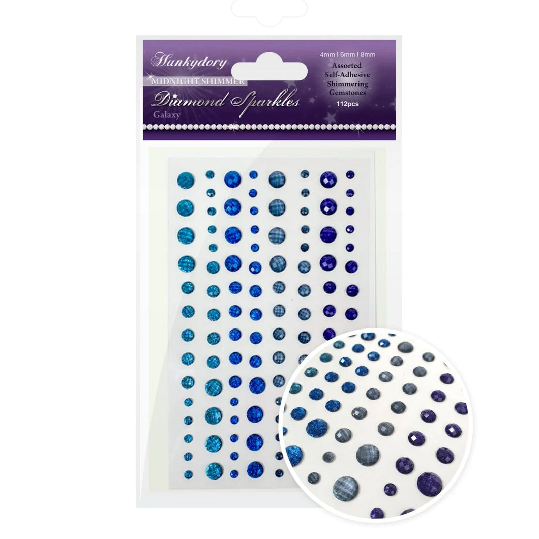 Hunkydory Crafts - Diamond Sparkles Gemstones - Midnight Shimmer - Galaxy. Marvellously moody colours of the galaxy are mirrored with lavish sparkle and shine with the new Diamond Sparkles Midnight Shimmer Selection. Available at Embellish Away located in Bowmanville Ontario Canada.