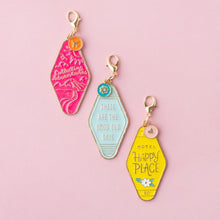 Load image into Gallery viewer, Paige Evans - Charms - 4/Pkg - Adventurous. Add a bit of shine and dimension to your projects with these beautiful enamel charm embellishments! Perfect for customizing scrapbooks and other DIYs, or add them to bags and backpacks for a fun accessory. Available at Embellish Away located in Bowmanville Ontario Canada.
