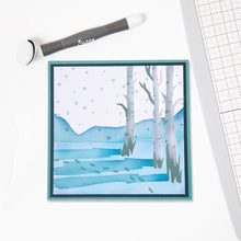 गैलरी व्यूवर में इमेज लोड करें, Sizzix - Making Tool Layered Stencil 6&quot;X6&quot; By Olivia Rose - Winter Scenes. Brrr! What a chilly scene, with bare birch trees, flakes falling and deep footprints in the snow this Winter Scene Layered Stencil is perfect for a wintery backdrop. Available at Embellish Away located in Bowmanville Ontario Canada.
