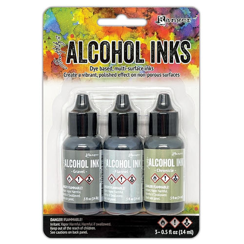 Tim Holtz - Alcohol Ink .5oz - 3/Pkg - Select from Drop Down. The alcohol inks by Ranger are dye based, multi-surface inks. They are acid free, permanent, quick drying and transparent. Available at Embellish Away located in Bowmanville Ontario Canada. Crossroads-Gravel/Flannel/Chronicle