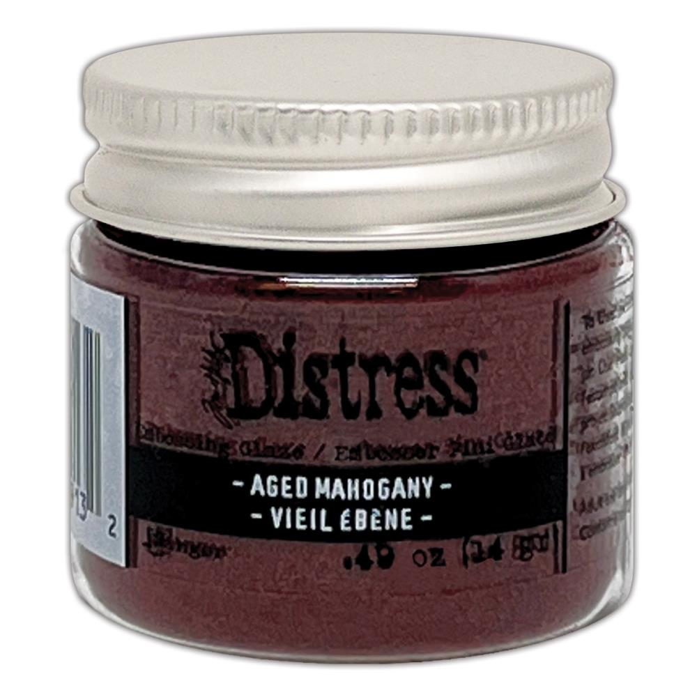 Tim Holtz - Distress Embossing Glaze - Aged Mahogany. Add dimension to your projects with new embossing glaze! These translucent embossing powders are ideal for layering on surfaces. Available at Embellish Away located in Bowmanville Ontario Canada.