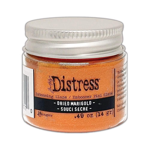 Tim Holtz - Distress Embossing Glaze - Dried Marigold. Add dimension to your projects with new embossing glaze! These translucent embossing powders are ideal for layering on surfaces. Available at Embellish Away located in Bowmanville Ontario Canada.