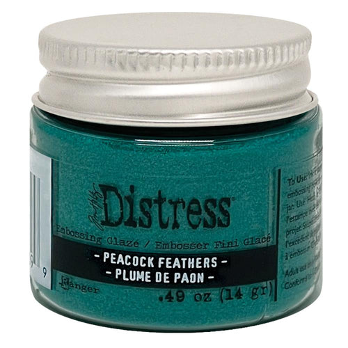 Tim Holtz - Distress Embossing Glaze - Peacock Feathers. Add dimension to your projects with new embossing glaze! These translucent embossing powders are ideal for layering on surfaces. Available at Embellish Away located in Bowmanville Ontario Canada.