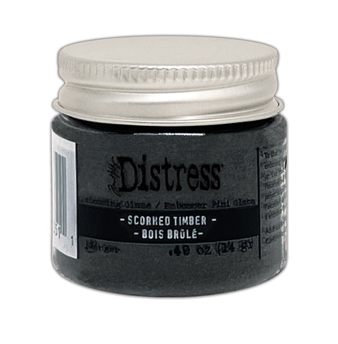 Tim Holtz - Distress Embossing Glaze - Scorched Timber. Add dimension to your projects with new embossing glaze! These translucent embossing powders are ideal for layering on surfaces. Available at Embellish Away located in Bowmanville Ontario Canada.