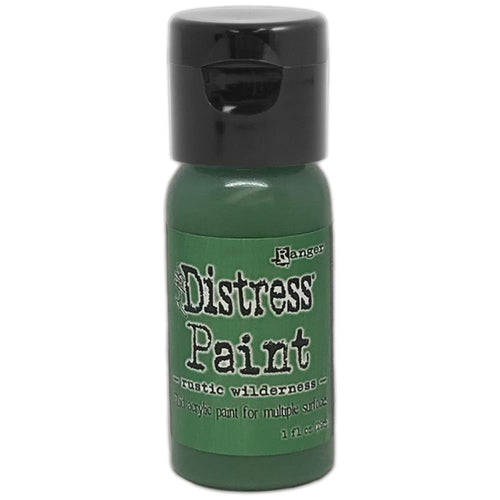 Tim Holtz - Distress Paint Flip Top 1oz - Rustic Wilderness. This package contains one 1oz bottle of acrylic paint. Comes in a variety of colors. Each sold separately. Made in USA. Available at Embellish Away located in Bowmanville Ontario Canada.