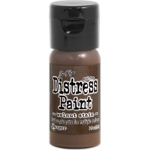 Tim Holtz - Distress Paint Flip Top 1oz - Walnut Stain. This package contains one 1oz bottle of acrylic paint. Comes in a variety of colors. Each sold separately. Made in USA. Available at Embellish Away located in Bowmanville Ontario Canada.