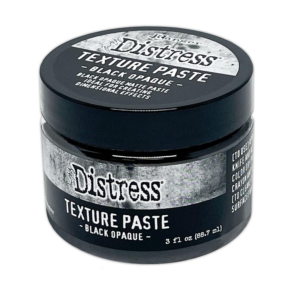 Tim Holtz - Distress Texture Paste - 3oz - Black Opaque. Tim Holtz Distress Mixed-Media Mediums Texture Paste Black Opaque will add a touch of textured goodness to Halloween creations! Available at Embellish Away located in Bowmanville Ontario Canada.
