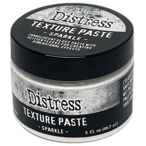 Tim Holtz - Distress Texture Paste - 3oz - Sparkle. Tim Holtz Holiday Mixed Media Medium - Sparkle Texture Paste will add a touch of texture and sparkle to Winter Holiday creations. Available at Embellish Away located in Bowmanville Ontario Canada.