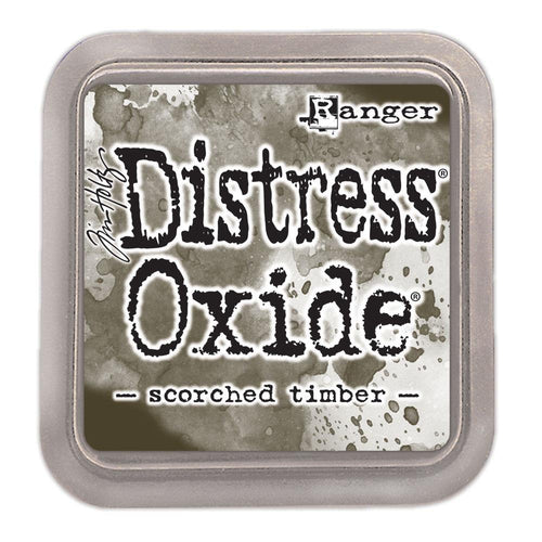 Tim Holtz - Distress Oxide Pad - Large. Create an aged look on papers, fibers, photos and more! This package contains one 2-1/4x2-1/4 inch ink pad. Comes in a variety of distressed colors. Each sold separately. Scorched Timber. Available at Embellish Away located in Bowmanville Ontario Canada.