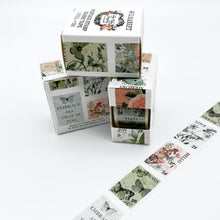 Load image into Gallery viewer, 49 And Market - Washi Tape Roll - Postage - Vintage Artistry Tranquility. One roll of die-cut postage washi tape. Roll of tape contains beautiful designed stamps with florals and botanicals on postage stamps that each measure 1x1.25 inches. Available at Embellish Away located in Bowmanville Ontario Canada.
