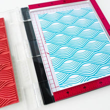 Cargar imagen en el visor de la galería, Catherine Pooler - Background Stamp - Making Waves. Create a funky background with the Making Waves Background Stamp. Grab your spa blues like Tranquil and Cove Blue for a natural effect or why not mix in bright and funky colors to add this wavy print to any festive card. This one will be fun for nautical cards and beyond! Available at Embellish Away located in Bowmanville Ontario Canada.
