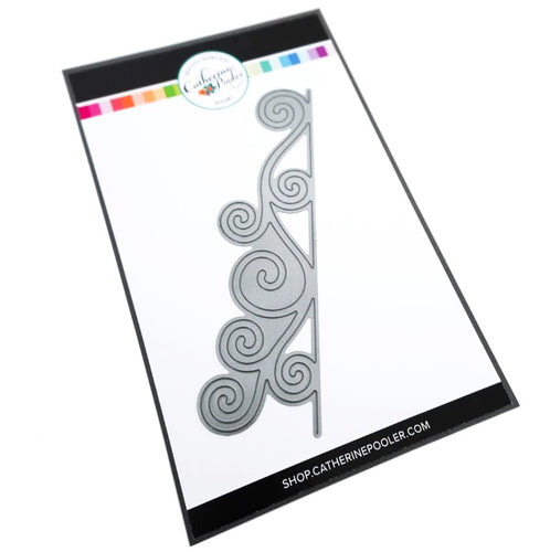 Catherine Pooler - Border Die - Scroll. The Scroll Border die adds the extra oomph to the edges of all your cards. Add the whimsy of the swirling snow or the edges of the sleigh it will make your cards w wintery delight. Available at Embellish Away located in Bowmanville Ontario Canada.