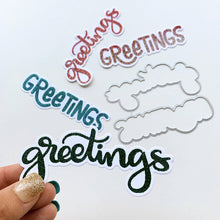 Load image into Gallery viewer, Catherine Pooler - Dies - Cheerful Greetings. Ready to make greetings cards for all seasons? The Cheerful Greetings Dies coordinates with our Cheerful Greeting Sentiments Stamp Set to cut out the two larger &quot;Greetings&quot; for all of your card needs all year long. Available at Embellish Away located in Bowmanville Ontario Canada. Die cut example
