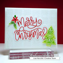 Load image into Gallery viewer, Catherine Pooler - Layered Word Dies - Merry Christmas. Use the thin die cut as a featured sentiment or layer up with a patterned or metallic paper behind for a bit of pop. Either way, this die will put the Merry in everyone&#39;s Christmas! Available at Embellish Away located in Bowmanville Ontario Canada. Card design by Lisa Harrolle.
