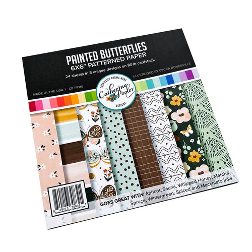 Catherine Pooler - Patterned Paper - Painted Butterflies. The Painted Butterflies Pattern Paper has a modern artistic vibe. This pack features butterflies and florals along with a mix of abstract patterns. Available at Embellish Away located in Bowmanville Ontario Canada.