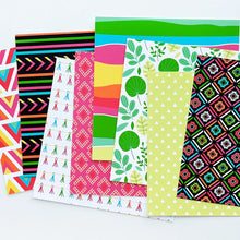 Load image into Gallery viewer, Catherine Pooler - Patterned Paper - Peruvian Market. Get transported to a Peruvian Market with this bright and vibrant paper pack. This 6x6 Patterned Paper features patterns inspired by traditional fabrics and jungle leaves. Available at Embellish Away located in Bowmanville Ontario Canada.
