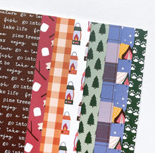 Load image into Gallery viewer, Catherine Pooler - Patterned Paper - S&#39;mores Please. Let&#39;s venture into the wild for a touch of nature with the S&#39;mores Please Patterned Paper pack! This pack of 6x6 paper features 8 patterns and prints inspired by camping in the great outdoors. Available at Embellish Away located in Bowmanville Ontario Canada.
