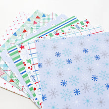 Load image into Gallery viewer, Catherine Pooler - Patterned Paper - Snow Day Birthday. The Snow Day Birthday Patterned Paper combines a frosty color combo with a birthday motif! Snowmen, holly filled florals and party hats are among some of the patterns and prints in this sweet pack. Available at Embellish Away located in Bowmanville Ontario Canada.
