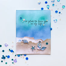 Cargar imagen en el visor de la galería, Catherine Pooler - Sequin Mix - Topsail. Imagine the sound of the waves and coral-pink shells scattered across the soft sand.  This is the inspiration behind the Topsail Beach Sequin mix.  This quaint North Carolina beach is a favorite spot for Catherine&#39;s family.  The mix is a beautiful blend of sparkly blues and a pop of coral.  It will give you all the mermaid vibes! Available at Embellish Away located in Bowmanville Ontario Canada. Card example by Catherine Pooler.
