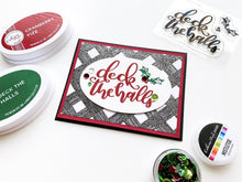 Load image into Gallery viewer, Catherine Pooler - Stamp Set - Deck the Halls. The perfect show stopper sentiment stamp for quick holiday cards, the Deck the Halls Stamp Set is a great add on. This hand scripted sentiment was designed to be the focal point of your holiday card. Available at Embellish Away located in Bowmanville Ontario Canada. Card example by Ctaherine Pooler.
