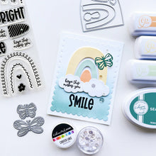 Load image into Gallery viewer, Catherine Pooler - Stamp &amp; Dies Set - Smile Bright. Smile Bright! This 6x8 Stamp Set and coordinating dies are ready for you to piece it together to your hearts content to create a modern, boho rainbow. Available at Embellish Away located in Bowmanville Ontario Canada. Card example by brand ambassador.

